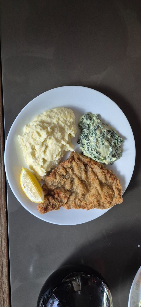 Wiener Schnitzel With Mashed Potatoes And Creamed Spinach